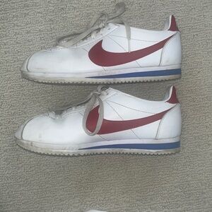 Red and white vintage Nike Cortez shoes